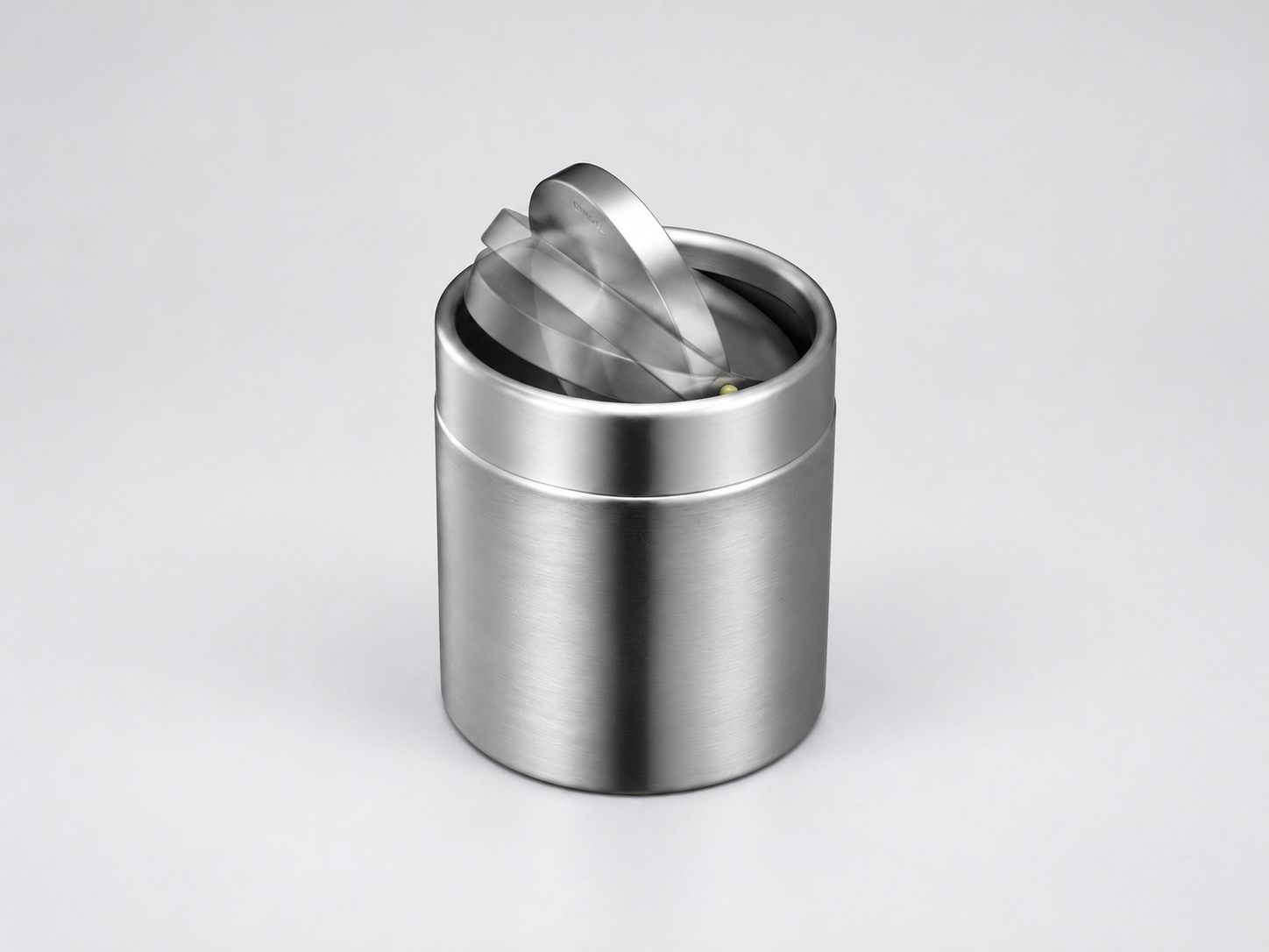 EKO Fandy Bin – Smooth Swing-Top Lid Mechanism Close-up of the EKO Fandy Table Bin showing its balanced stainless steel swing lid in an open position.