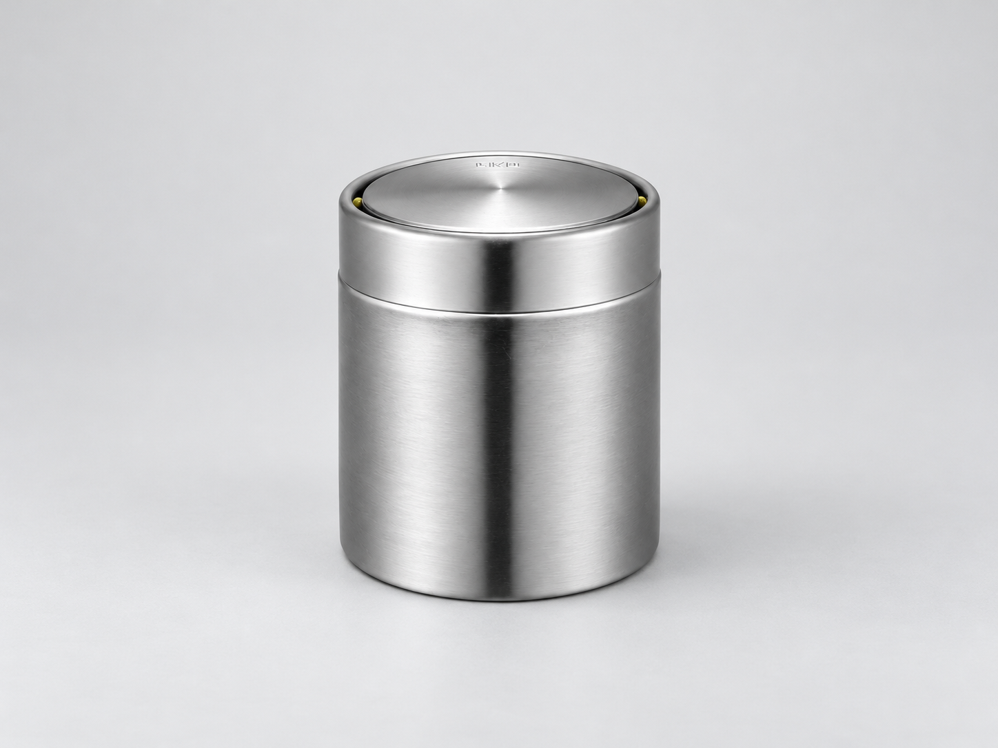 EKO Fandy 1.5L Stainless Steel Table Bin – Silver Front view of the EKO Fandy 1.5L stainless steel mini table bin with closed circular swing lid on a white background.